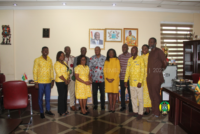 The team and the mayor in a group photograph